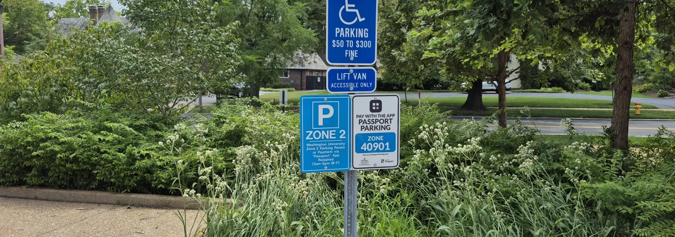 Photo of a parking sign at WashU for an accessible parking space
