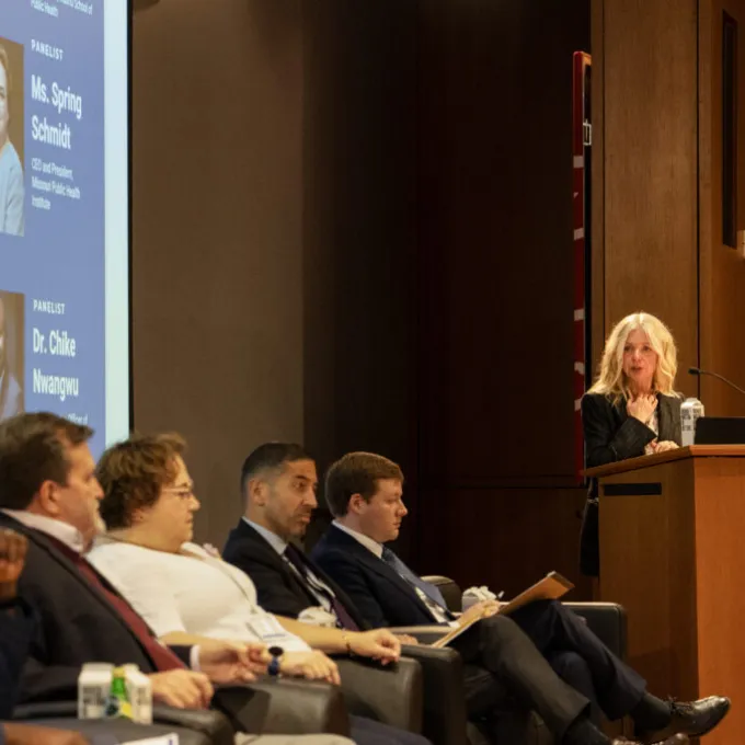 Margaret Kruk (right) introduces panelists for a discussion on challenges facing health systems. (Photo: Zachary Linhares/School of Public Health)